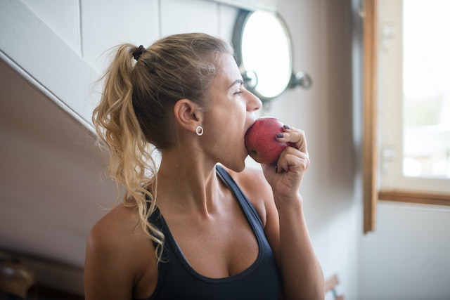 Woman eating an apple