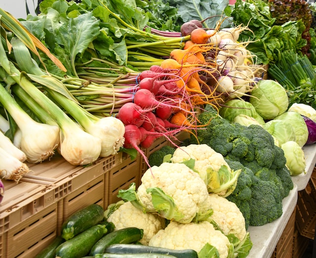 A variety of vegetables on display on a shelf
