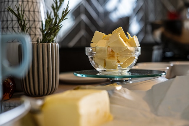 Cubed pieces of butter inside a clear glass bowl