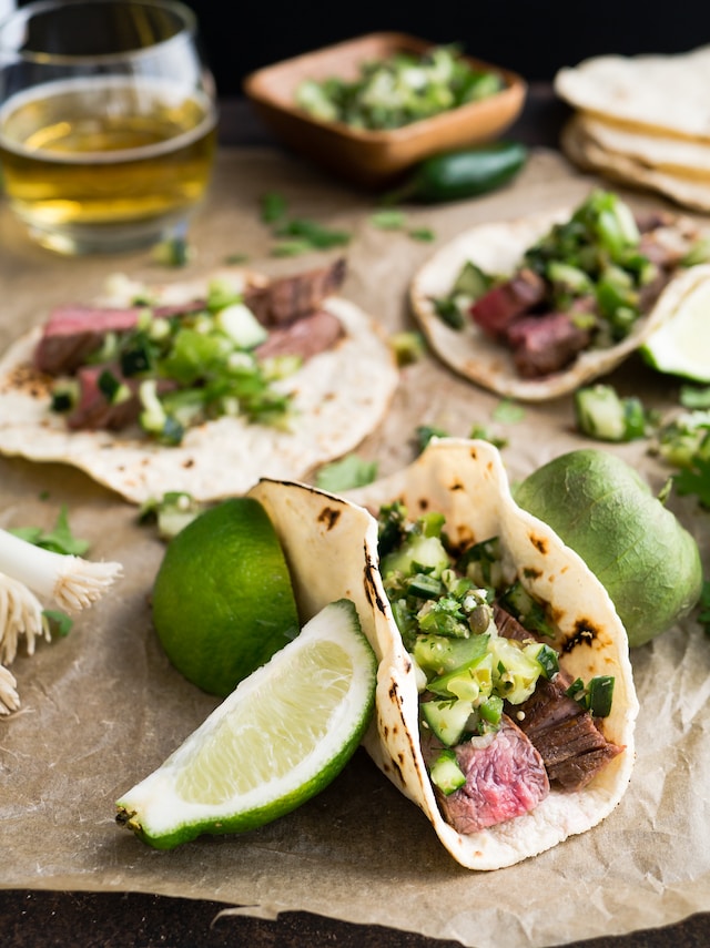 Taco servings with lime slices on the side