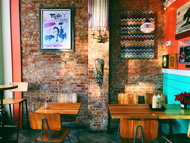 A restaurant with an assortment of colorful decors on the wall