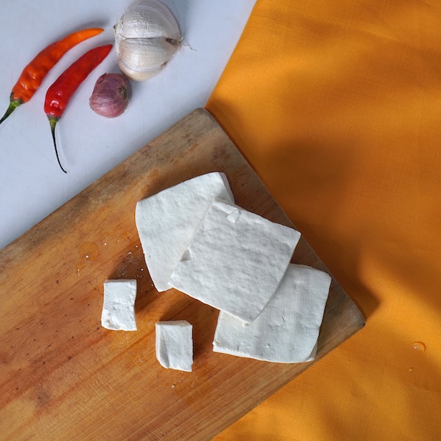 Tofu on a wooden cutting board