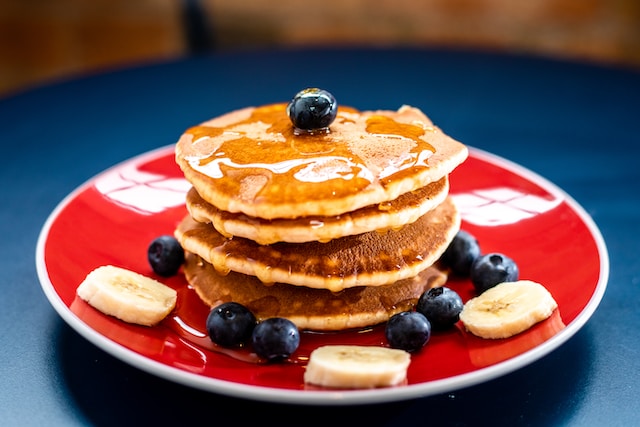 Stack of pancakes on a red plate