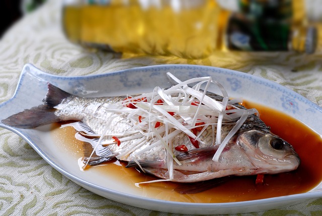 Steamed fish in a fish-shaped dish